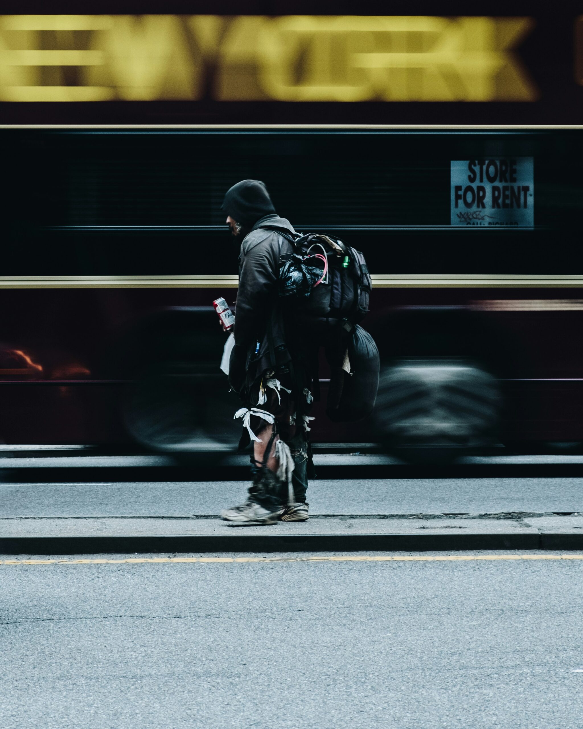 man walking while train drives by